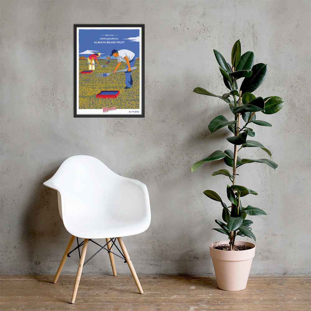 A chair next to a plant and a Shop Wyman's From a Land Where Goodness Always Bears Fruit Poster.