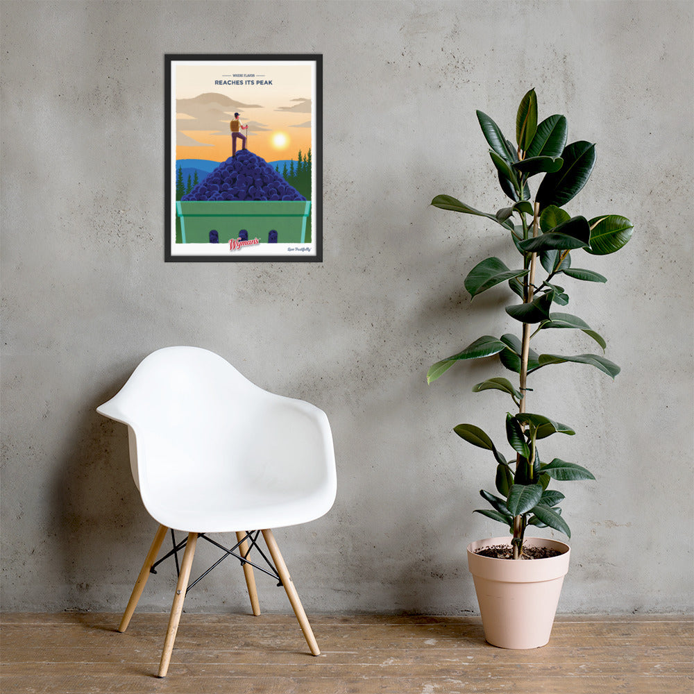 A framed Where Flavor Reaches its Peak Poster from Shop Wyman's with a picture of a mountain and a chair in front of it.
