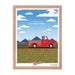 A framed From Our Fields to Your Family poster featuring a print of a red truck driving down the road from Shop Wyman's.