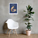 A chair with a plant and a Behold Mother Nature's Tiniest Kept Secret Poster from Shop Wyman's on the wall.