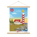 A custom 150 Years, This is Wild Poster with a lighthouse and a candle, featuring high-quality printing finishes, hanging on the wall by Shop Wyman's.