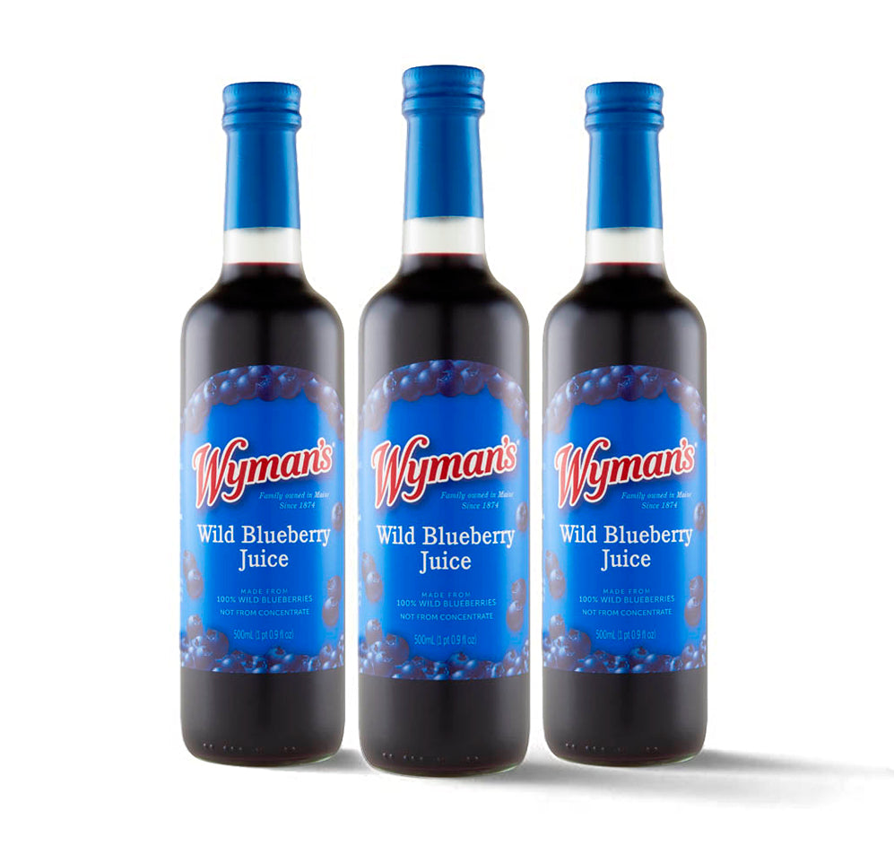 Three bottles of delicious Whitney Wild Blueberry Juice - 100% Juice on a white background.