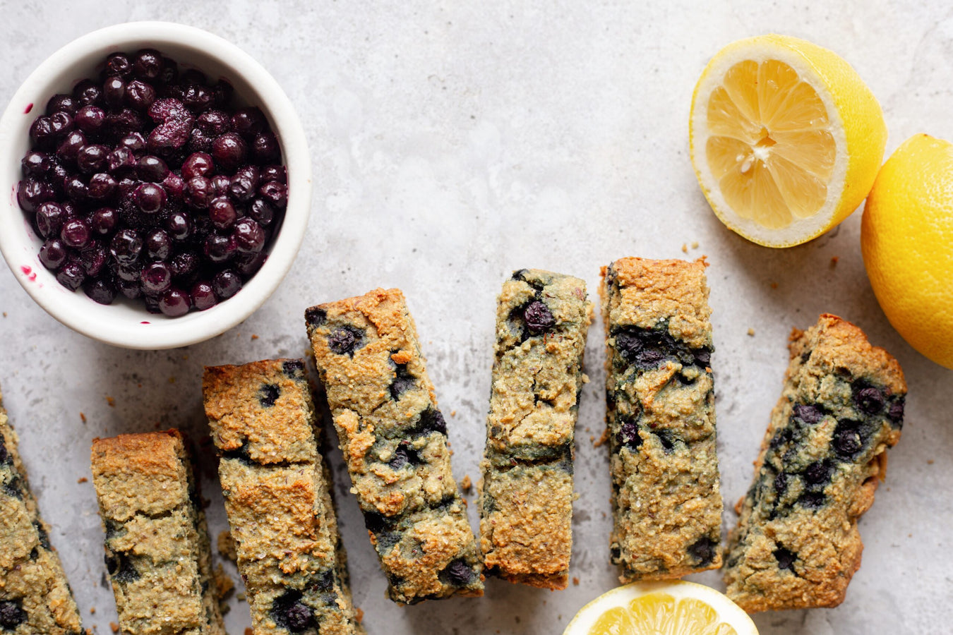 A plate of blueberry bars with lemons and lemons.