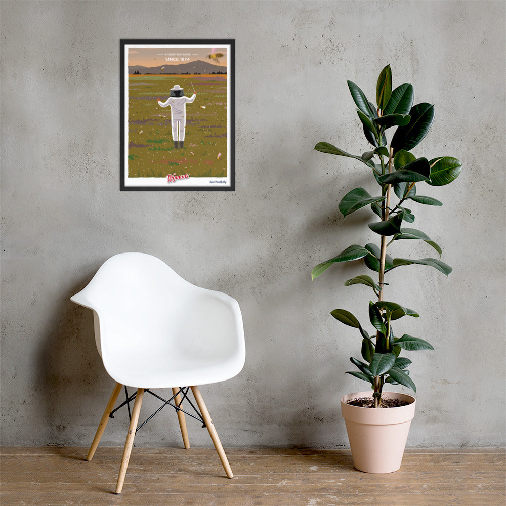 A chair next to a Shop Wyman's custom display of the In Concert with Nature Since 1874 Poster featuring a woman in a field.