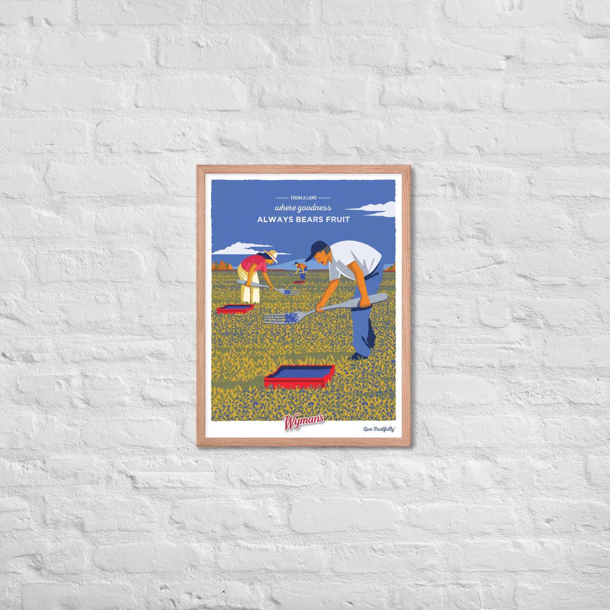 A "From a Land Where Goodness Always Bears Fruit" poster from Shop Wyman's with a picture of a man and a woman in a field, holding blueberries.