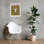 A chair next to a wall with a Shop Wyman's In Concert with Nature Since 1874 Poster on it.