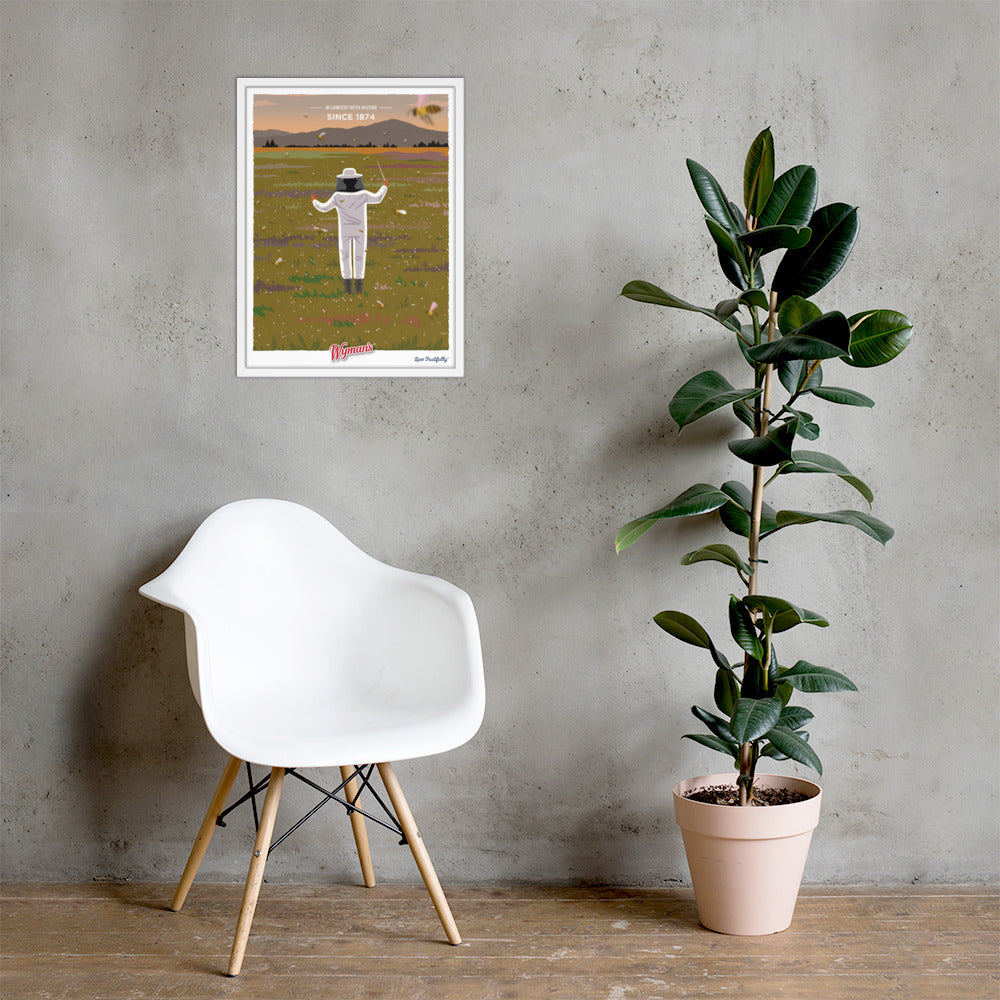 A chair next to a wall with a Shop Wyman's In Concert with Nature Since 1874 Poster on it.