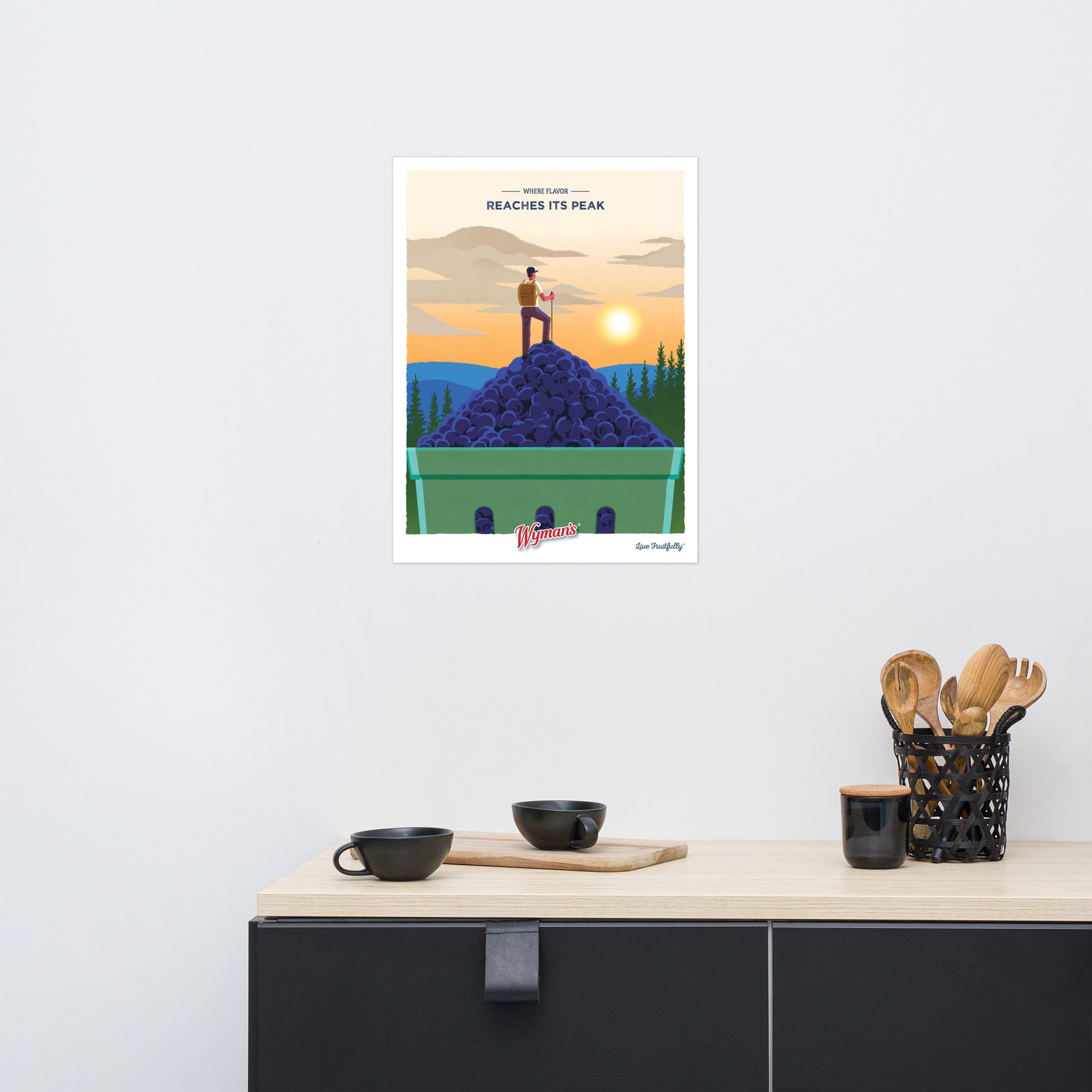 A kitchen with a Shop Wyman's Where Flavor Reaches its Peak Poster on the wall.