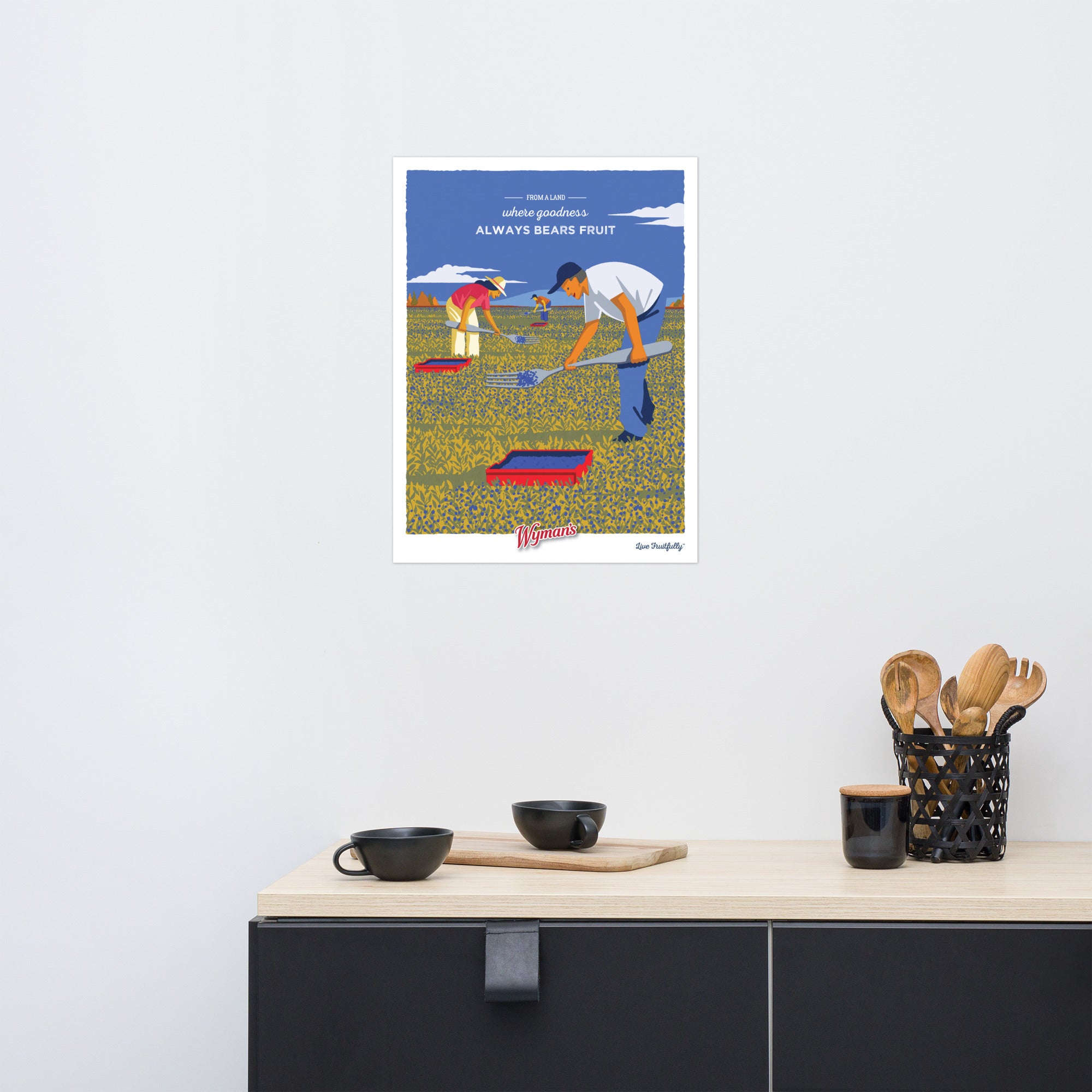 A printing of a From a Land Where Goodness Always Bears Fruit Poster with a man and a woman in a kitchen by Shop Wyman's.
