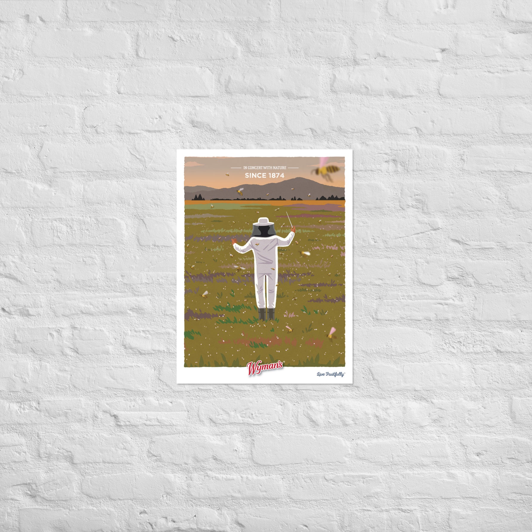 A Shop Wyman's "In Concert with Nature Since 1874" poster, featuring custom printing finishes, showcases an image of a man in a field.