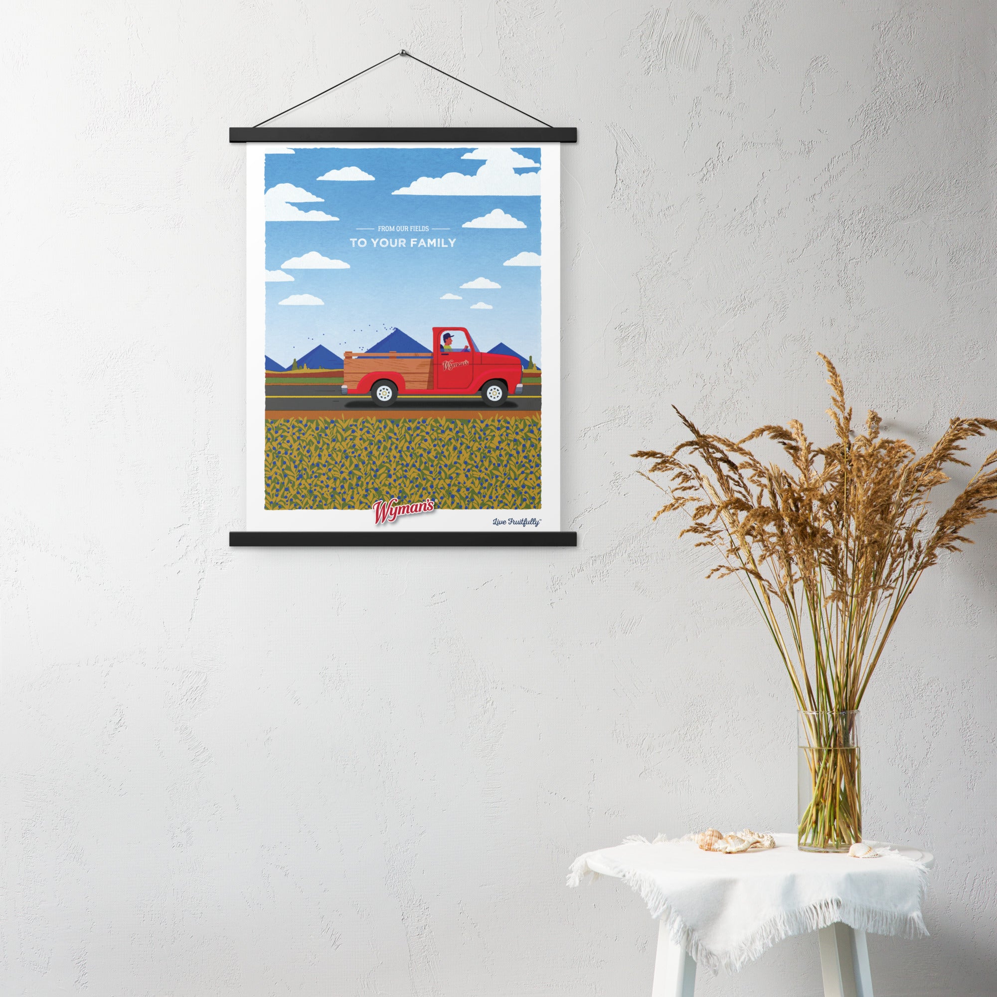 A Shop Wyman's poster of a red truck with a unique design hanging on a wall.