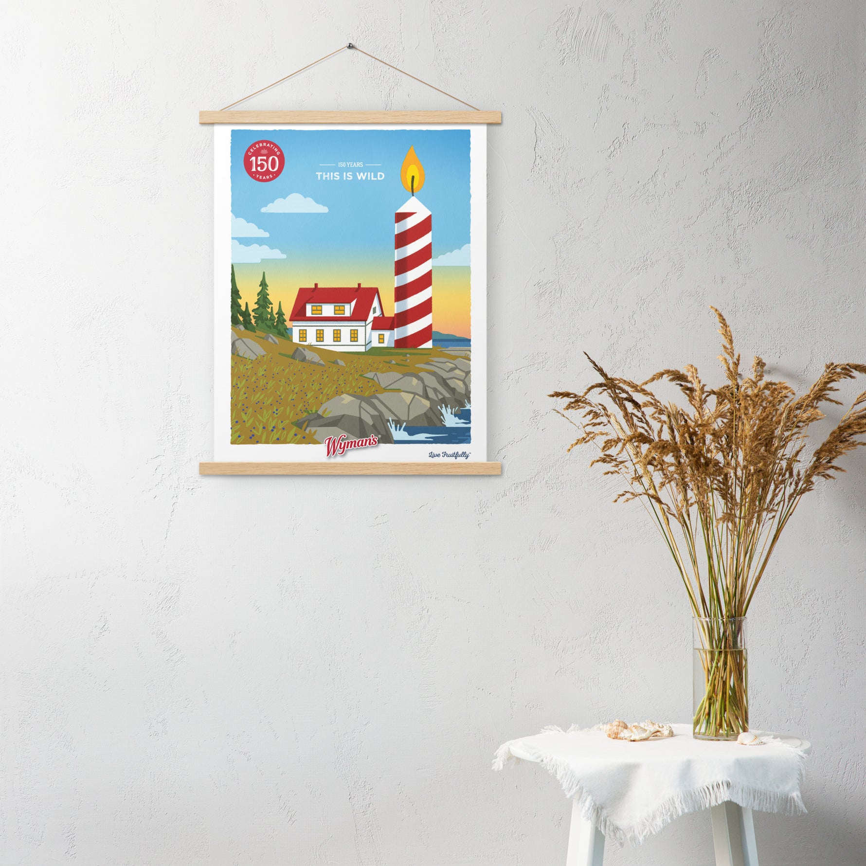 A custom 150 Years, This is Wild poster from Shop Wyman's with special printing finishes hanging on a wall.