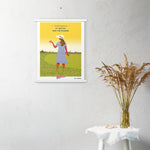 A Shop Wyman's custom poster hanging on a wall with a woman in a field.