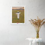 A Shop Wyman's In Concert with Nature Since 1874 Poster hangs on a wall with a picture of a person in a field.