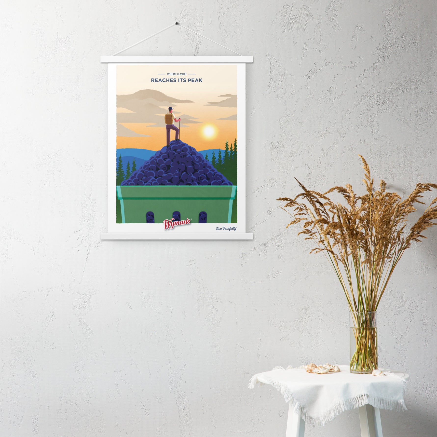A Shop Wyman's Where Flavor Reaches its Peak Poster with an image of a woman standing on top of a hill.